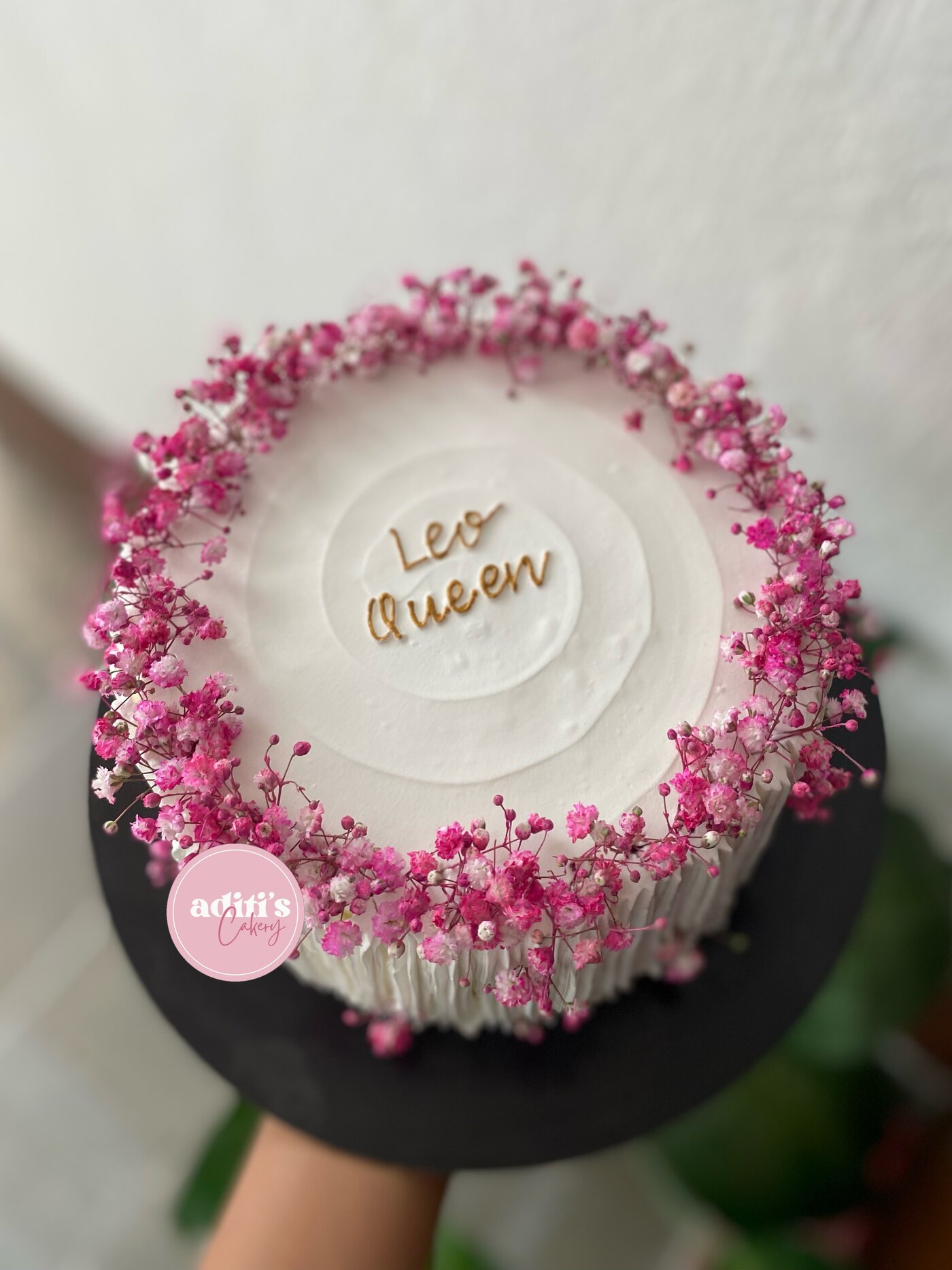 Pink sprinkle cake with a gold topper